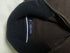 Front view of vintage Nautica chocolate brown quarter-zip cotton sweater laid flat showing zip collar and tonal logo